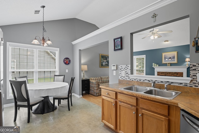 kitchen with visible vents, lofted ceiling, a sink, ceiling fan with notable chandelier, and dishwasher