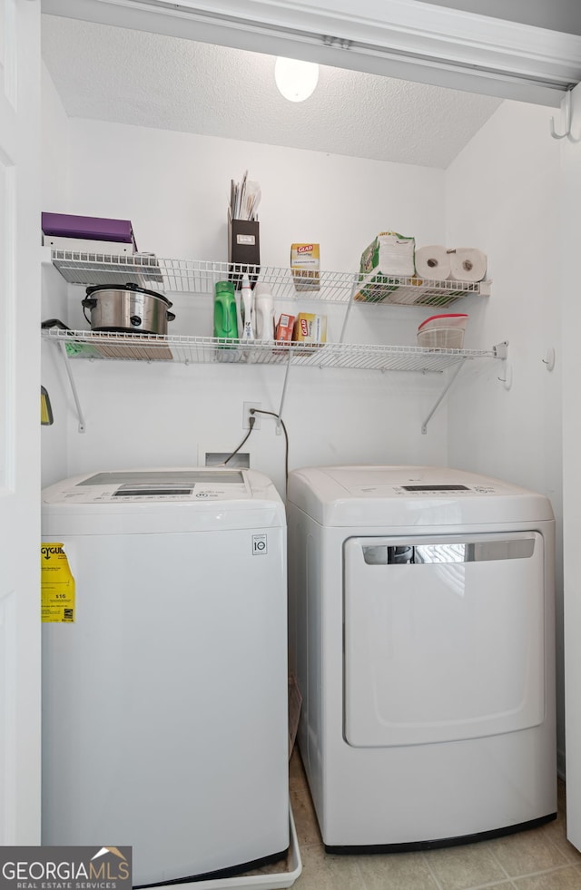 laundry room featuring laundry area and washing machine and dryer
