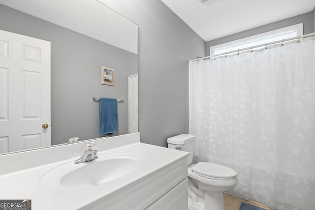full bathroom with toilet, curtained shower, and vanity