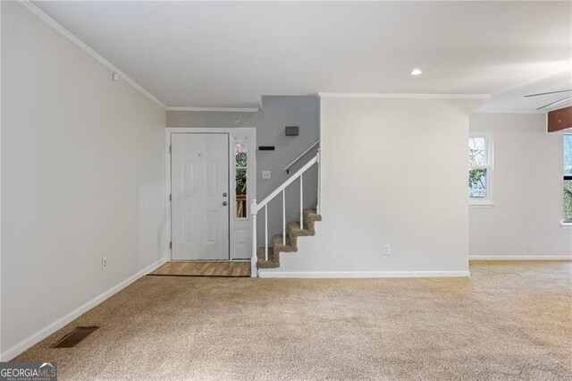 1350 Overlook Cv SE, Smyrna, GA 30080 - carpeted foyer entrance featuring visible vents, ornamental molding, baseboards, stairway, and recessed lighting