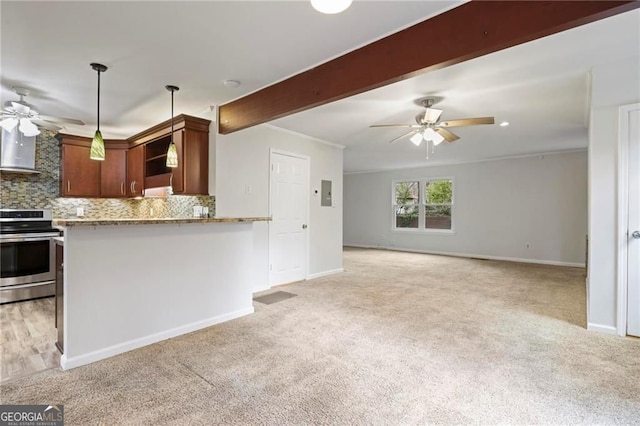 1350 Overlook Cv SE, Smyrna, GA 30080 - kitchen with light colored carpet, electric stove, ceiling fan, and wall chimney range hood