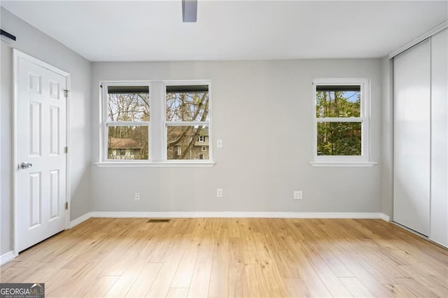 1350 Overlook Cv SE, Smyrna, GA 30080 - unfurnished bedroom with a ceiling fan, baseboards, visible vents, and light wood-style flooring