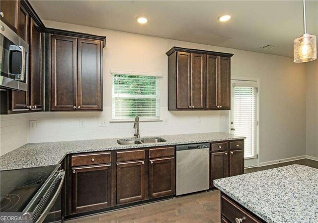 2539 Hedgeway Cir, Kennesaw, GA 30144 - kitchen featuring a sink, appliances with stainless steel finishes, and dark brown cabinets