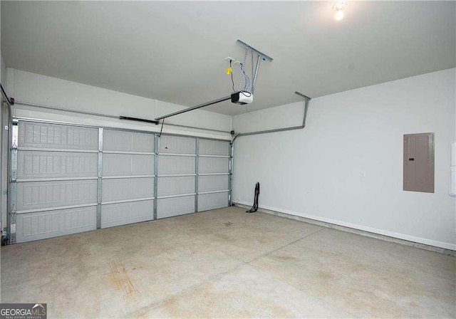 2539 Hedgeway Cir, Kennesaw, GA 30144 - garage with baseboards, a garage door opener, and electric panel