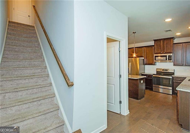 2539 Hedgeway Cir, Kennesaw, GA 30144 - stairs with visible vents, recessed lighting, baseboards, and wood finished floors