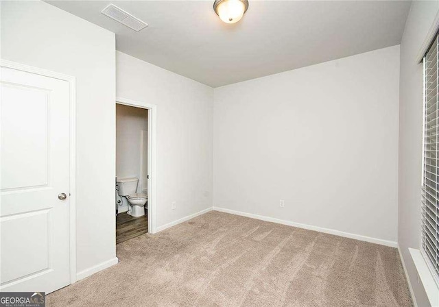 2539 Hedgeway Cir, Kennesaw, GA 30144 - unfurnished bedroom with baseboards, carpet flooring, ensuite bath, and visible vents
