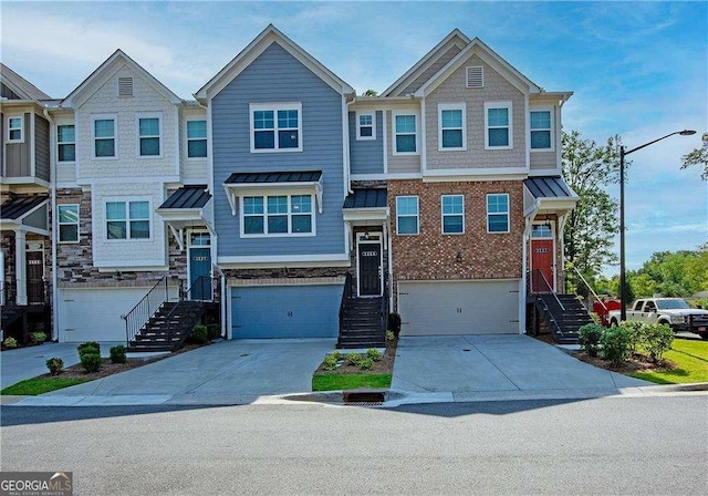 2539 Hedgeway Cir, Kennesaw, GA 30144 - view of property featuring a standing seam roof, metal roof, driveway, a garage, and stairs