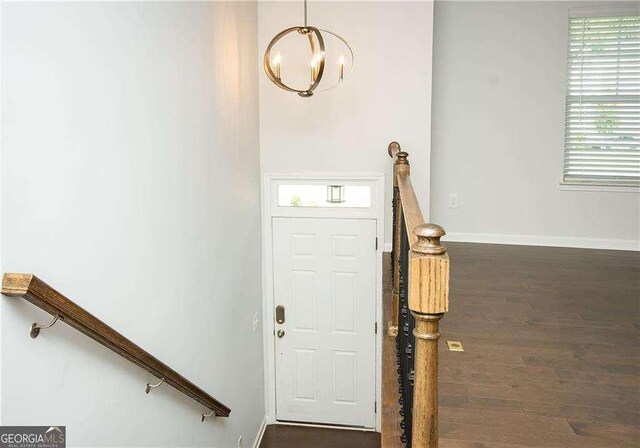 2539 Hedgeway Cir, Kennesaw, GA 30144 - foyer featuring baseboards, a notable chandelier, and wood finished floors