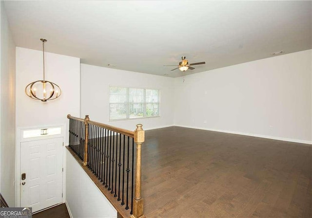 2539 Hedgeway Cir, Kennesaw, GA 30144 - interior space with baseboards, ceiling fan with notable chandelier, and dark wood-style flooring