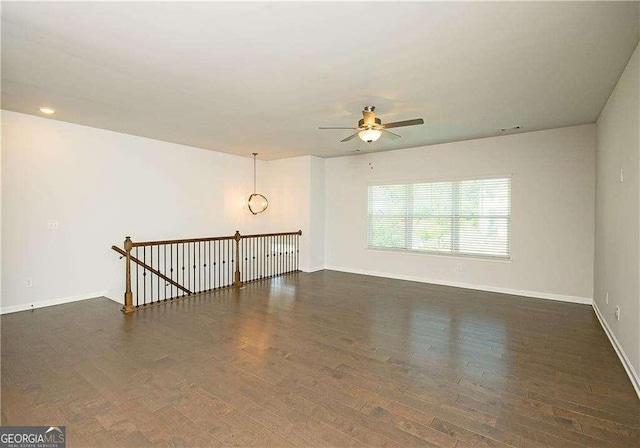 2539 Hedgeway Cir, Kennesaw, GA 30144 - unfurnished room with baseboards, ceiling fan, and wood finished floors