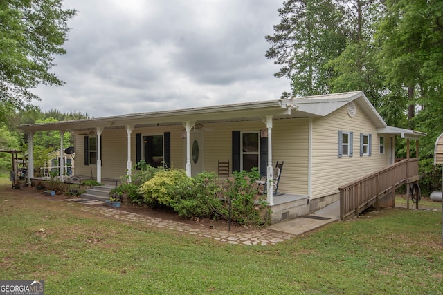 view of front facade featuring a porch, a front lawn, and crawl space