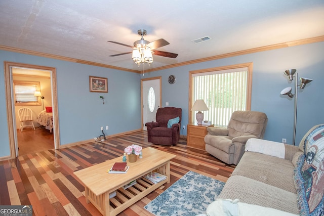 living area featuring a ceiling fan, wood finished floors, and visible vents