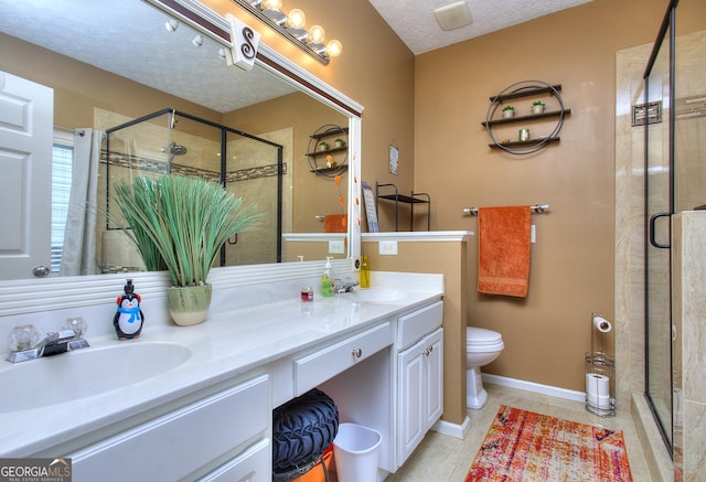 bathroom featuring a sink, a shower stall, and double vanity