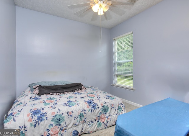bedroom featuring carpet floors, baseboards, and ceiling fan