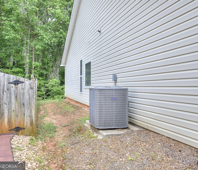 view of property exterior with central AC