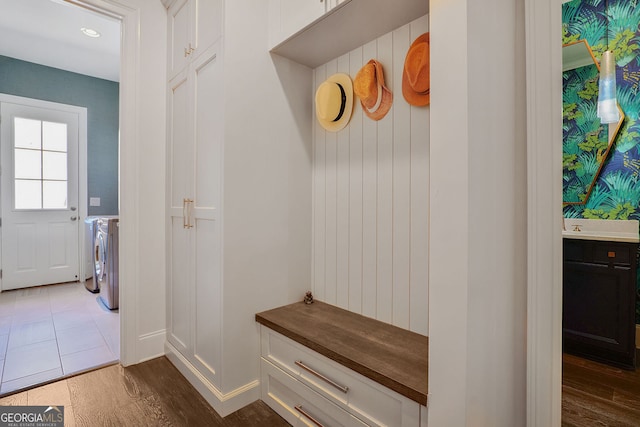 mudroom featuring recessed lighting, dark wood finished floors, and washer and dryer