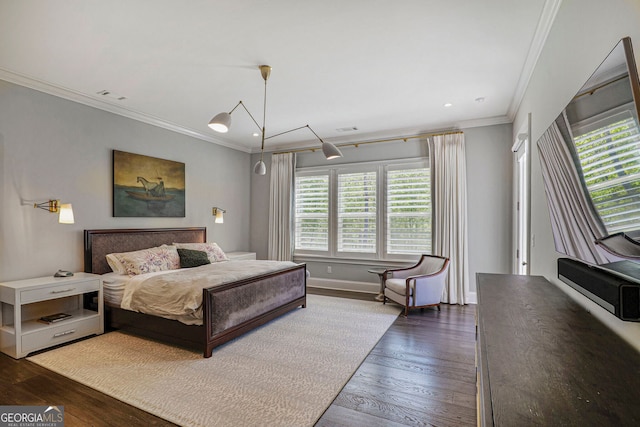 bedroom with multiple windows, ornamental molding, and dark wood-style flooring