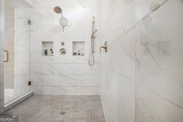 bathroom featuring a shower stall