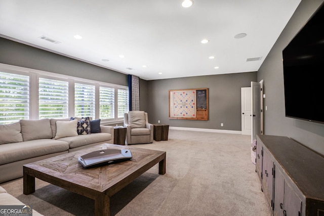 living room with visible vents, recessed lighting, baseboards, and light colored carpet