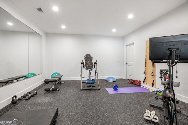 exercise area featuring recessed lighting and baseboards