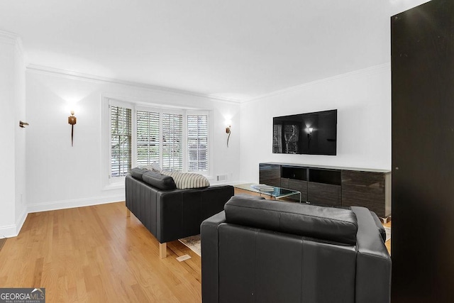 11 Ardmore Sq NW, Atlanta, GA 30309 - living area with ornamental molding, light wood finished floors, and baseboards