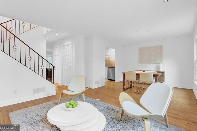 11 Ardmore Sq NW, Atlanta, GA 30309 - living area featuring stairway, baseboards, light wood-style floors, crown molding, and recessed lighting