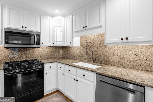11 Ardmore Sq NW, Atlanta, GA 30309 - kitchen featuring appliances with stainless steel finishes, a sink, white cabinetry, light stone countertops, and recessed lighting