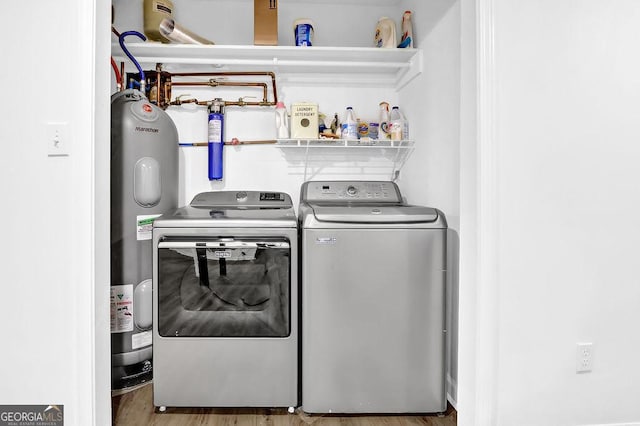 11 Ardmore Sq NW, Atlanta, GA 30309 - laundry room featuring washer and clothes dryer, water heater, and wood finished floors