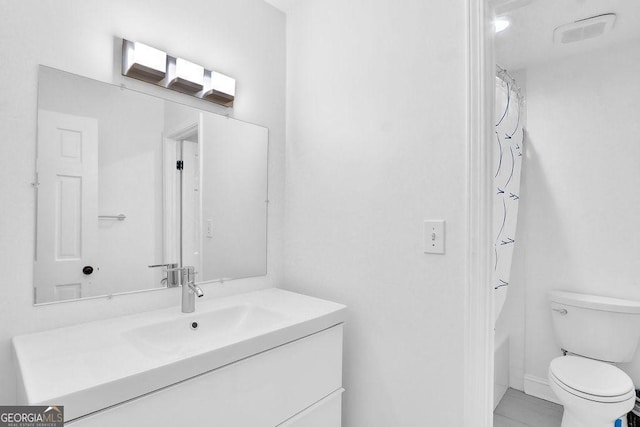 11 Ardmore Sq NW, Atlanta, GA 30309 - bathroom featuring vanity, toilet, and shower / tub combo