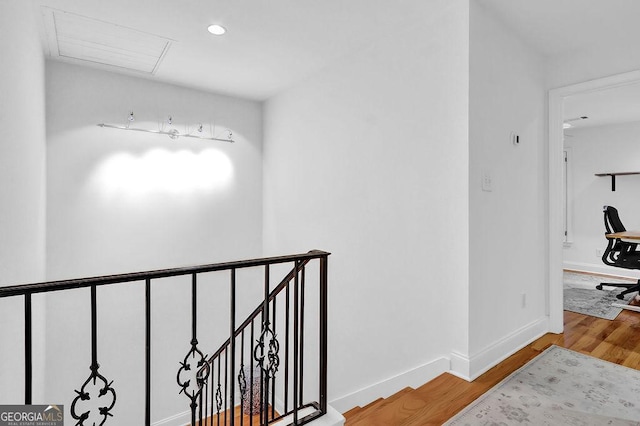 11 Ardmore Sq NW, Atlanta, GA 30309 - hall with attic access, wood finished floors, recessed lighting, baseboards, and an upstairs landing