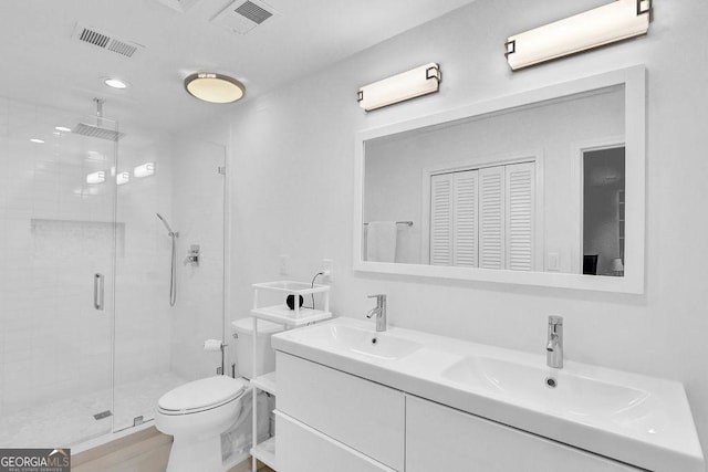 11 Ardmore Sq NW, Atlanta, GA 30309 - full bathroom with a stall shower, toilet, and double vanity