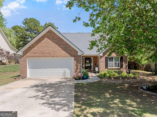 1338 Jefferson Station Rd, Jefferson, GA 30549 - view of front of house featuring brick siding, an attached garage, and driveway