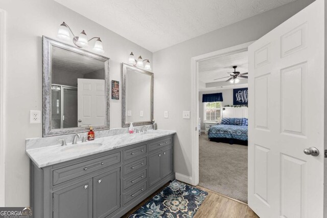 1338 Jefferson Station Rd, Jefferson, GA 30549 - carpeted bedroom featuring a raised ceiling, ceiling fan, crown molding, and ensuite bathroom