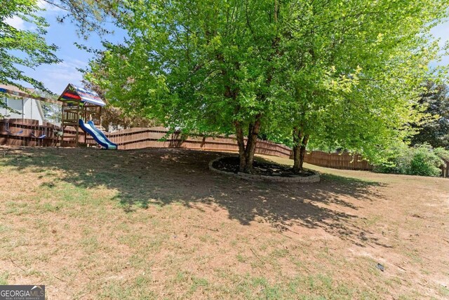 1338 Jefferson Station Rd, Jefferson, GA 30549 - fenced backyard with a playground
