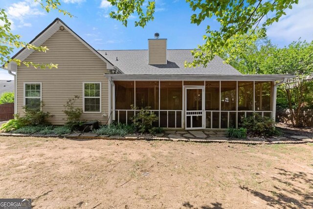 1338 Jefferson Station Rd, Jefferson, GA 30549 - back of house with a chimney, a sunroom, and roof with shingles