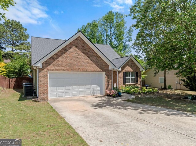 1338 Jefferson Station Rd, Jefferson, GA 30549 - view of front of house featuring a garage, concrete driveway, brick siding, and a shingled roof