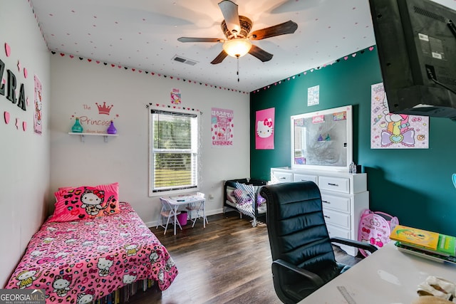 bedroom with visible vents, baseboards, ceiling fan, and wood finished floors