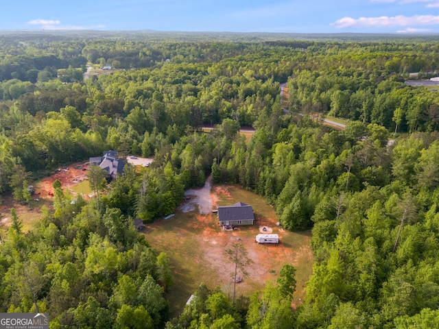 aerial view featuring a wooded view