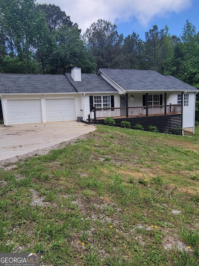 129 Carolyn Path, Rockmart, GA 30153 - ranch-style house featuring driveway, a garage, a front yard, a deck, and a chimney