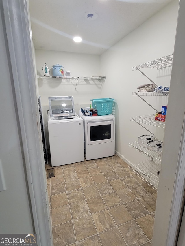 129 Carolyn Path, Rockmart, GA 30153 - laundry room with independent washer and dryer, stone finish flooring, and baseboards