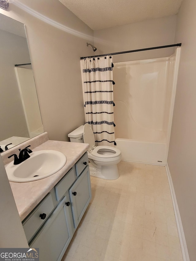 129 Carolyn Path, Rockmart, GA 30153 - bathroom featuring toilet, shower / bath combination with curtain, vanity, and a textured ceiling