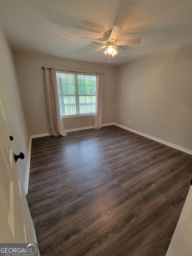 129 Carolyn Path, Rockmart, GA 30153 - empty room featuring a textured ceiling, dark wood finished floors, ceiling fan, and baseboards