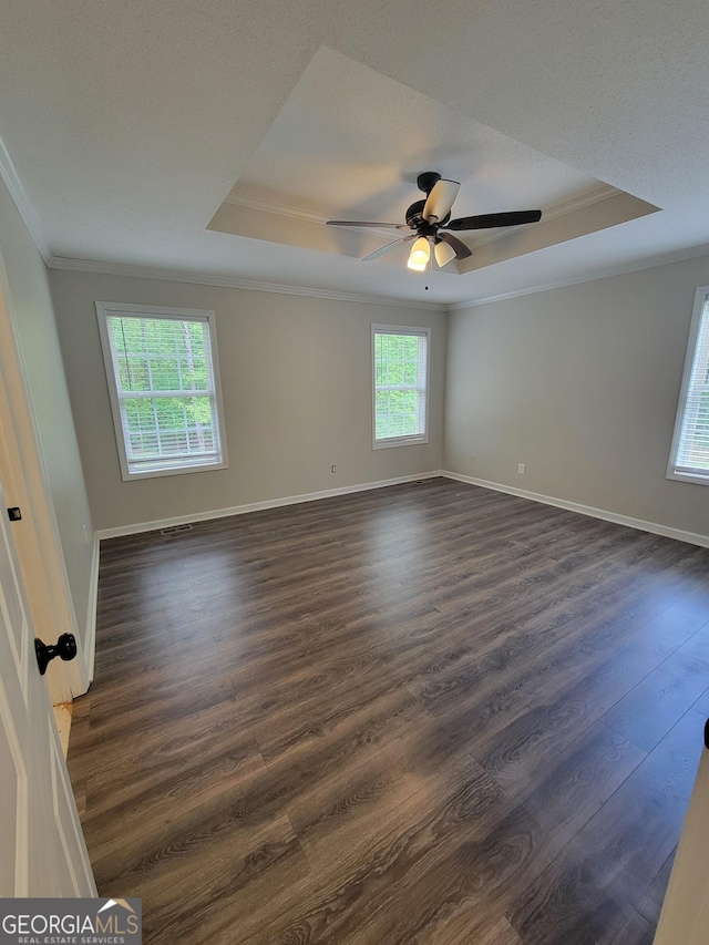 129 Carolyn Path, Rockmart, GA 30153 - unfurnished room with a tray ceiling, ornamental molding, dark wood-style flooring, and baseboards