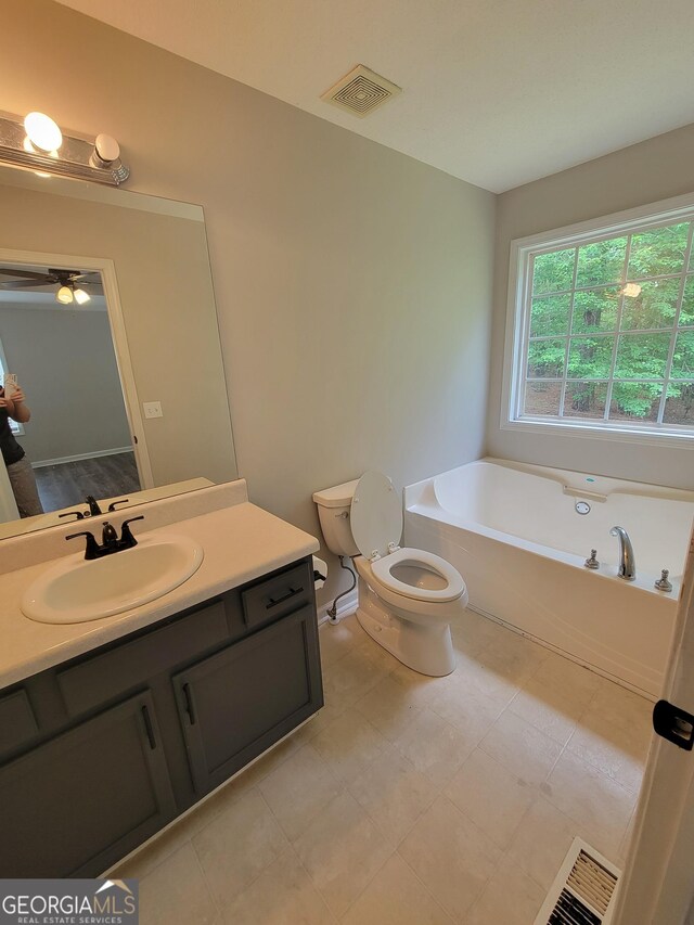 129 Carolyn Path, Rockmart, GA 30153 - full bath with a bath, toilet, vanity, and ceiling fan