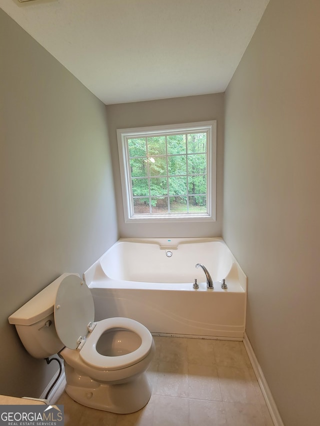 129 Carolyn Path, Rockmart, GA 30153 - full bath with toilet, a garden tub, tile patterned floors, and baseboards