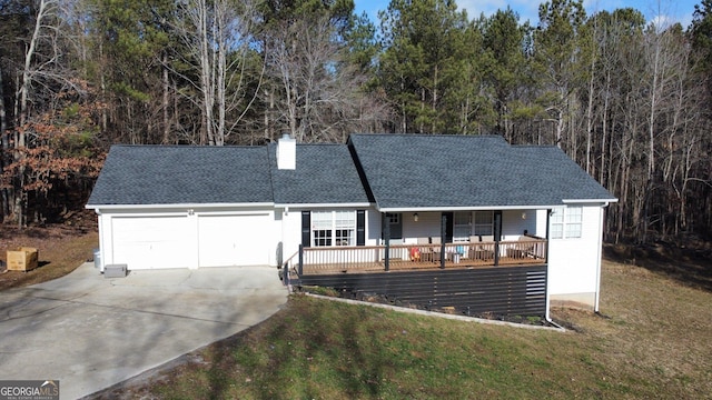 129 Carolyn Path, Rockmart, GA 30153 - view of front of house featuring an attached garage, concrete driveway, a porch, and a front lawn