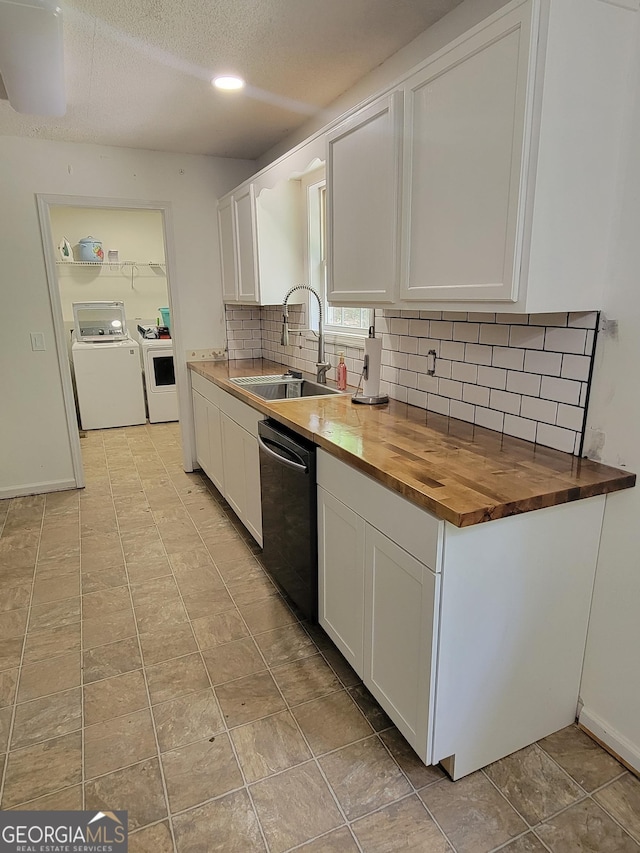 129 Carolyn Path, Rockmart, GA 30153 - kitchen featuring dishwasher, a sink, wood counters, washer and dryer, and white cabinets
