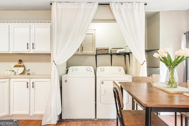 709 Tallapoosa Hwy, Cedartown, GA 30125 - laundry room with washing machine and dryer and light wood-style flooring