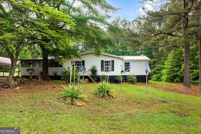 709 Tallapoosa Hwy, Cedartown, GA 30125 - exterior space featuring a sunroom and a front lawn