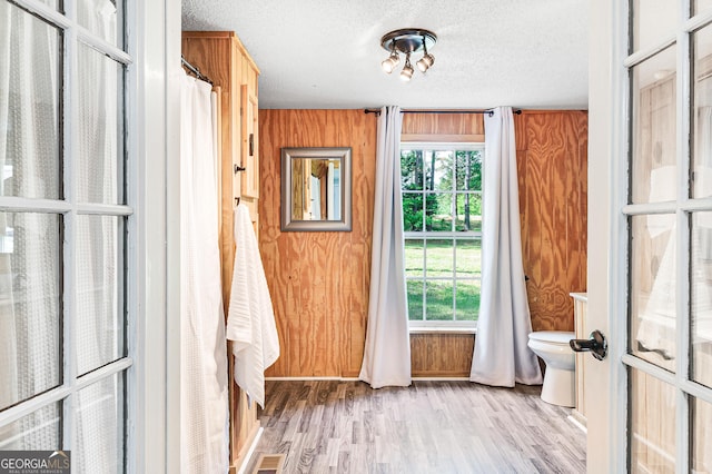 709 Tallapoosa Hwy, Cedartown, GA 30125 - doorway with a textured ceiling, wood finished floors, and visible vents